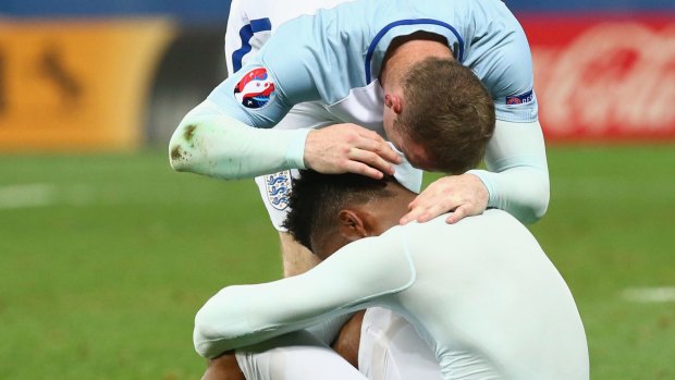 Feeling the pain: Daniel Sturridge is consoled by Wayne Rooney.