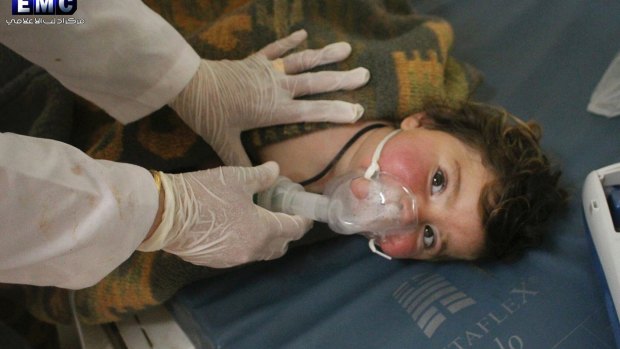 A child victim of the chemical attack is treated at a makeshift hospital. 