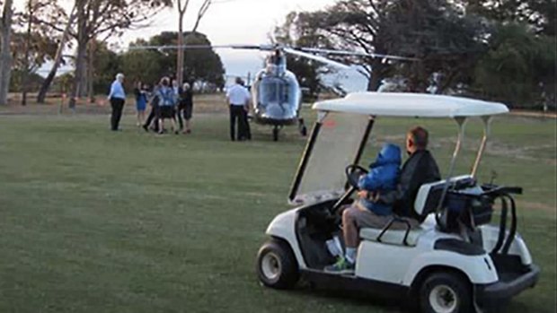 Bronwyn Bishop arrives by helicopter at a golf course for a Liberal fundraiser.