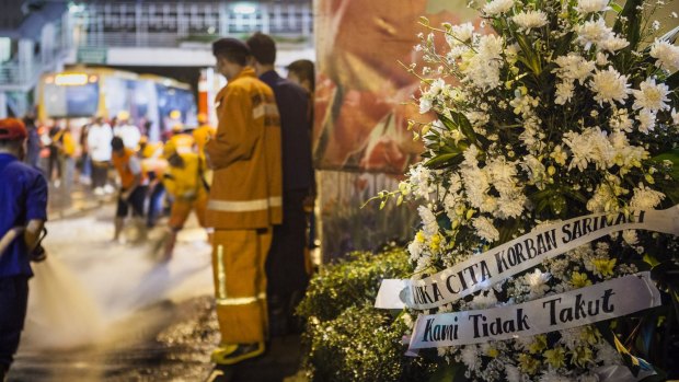 A bouquet of flowers placed in front of the explosion site in the centre of the Indonesian capital.