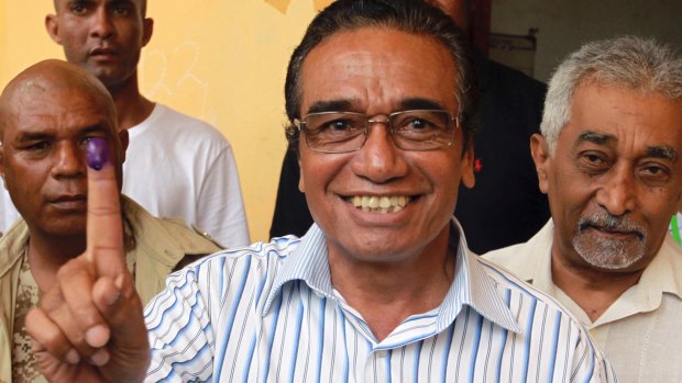 Fretilin leader Francisco "Lu-Olo" Guterres, centre, is seen with former prime minister Mari Alkatiri, right, after voting.