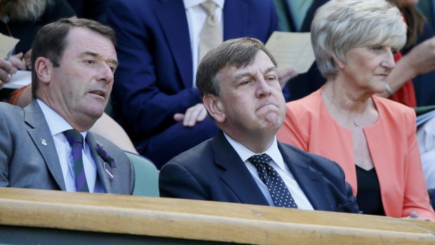 John Whittingdale, centre, Secretary of State for Culture, Media and Sport at the Wimbledon Tennis Championships in London this week. 