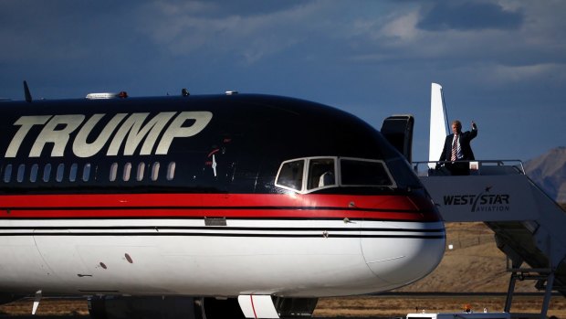 Donald Trump waves to supporters as he debarks his plane in Grand Junction, Colorado. 