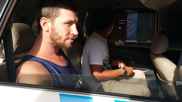 Shaun Davidson waiting to be transferred to Kerobokan jail in Bali after being charged with possessing another person's identity and overstaying his visa in April last year.