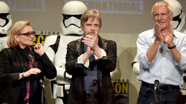 Carrie Fisher, Mark Hamill and Harrison Ford onstage at the Lucasfilm panel during Comic-Con International 2015.