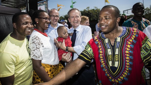 Bill Shorten with NSW Opposition Leader Luke Foley in the crowd at the Africultures Festival in Lidcombe on Saturday.