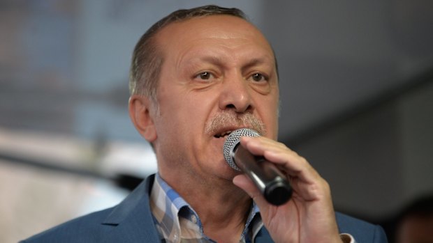 Turkish President Tayyip Erdogan delivers a speech to his supporters in Istanbul after the failed coup.