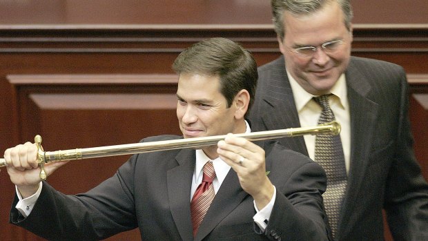Happier days: Marco Rubio, left, with the ceremonial sword presented to him by his mentor (then-Florida Governor) Jeb Bush as Rubio was designated as the next Florida Speaker of the House. Bush and Rubio are now both fighting to be the Republican presidential nominee. 