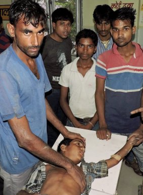 A boy who was hurt on Tuesday after being struck by lightning receives treatment at the district hospital in Ballia in India's Uttar Pradesh state.
