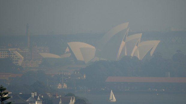 Sydney Opera house covered in haze from hazard reduction burns last May.