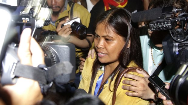 Marites Veloso, Mary Jane Veloso's sister, surrounded by media after visiting her sister on Wednesday.