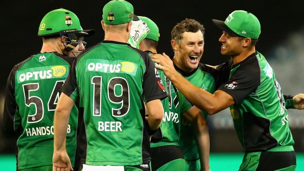 Key wicket:  David Hussey of the Stars celebrates taking the wicket of Usman Khawaja during the Big Bash final.