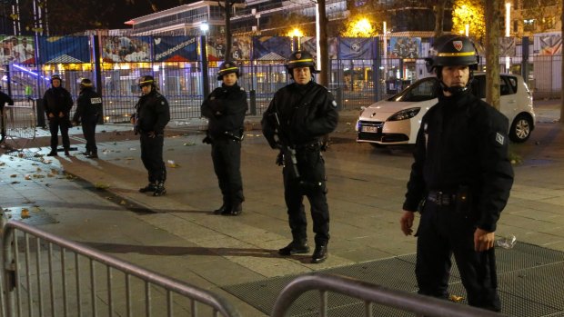 Police officers secure the Stade de France after the attack.