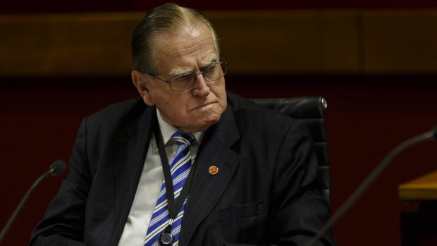 The Reverend Fred Nile is considering moving an amendment to ensure power workers cannot be sacked.