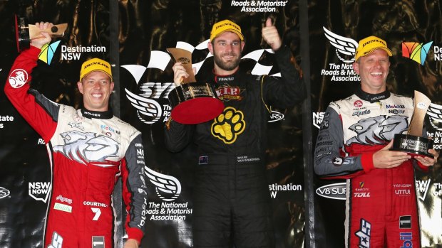 Shane van Gisbergen celebrates his race win ahead of James Courtney (left) and Garth Tander (right).