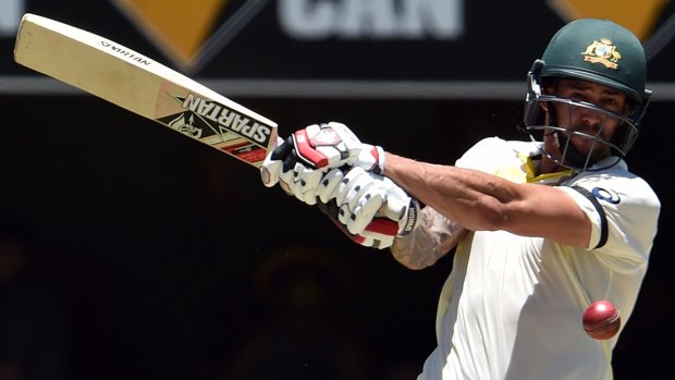 Take that: Mitchell Johnson belts one away during his whirlwind knock.