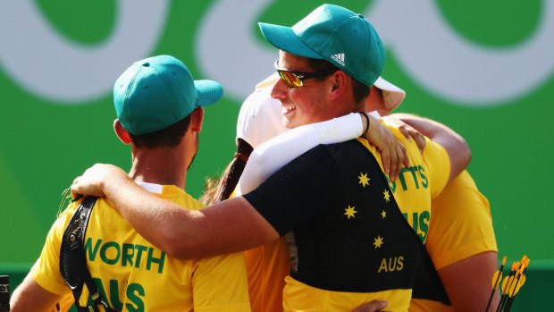 Medal joy: archers Taylor Worth, Alec Potts and Ryan Tyack earned bronze with an unblinking display at the Sambodoro