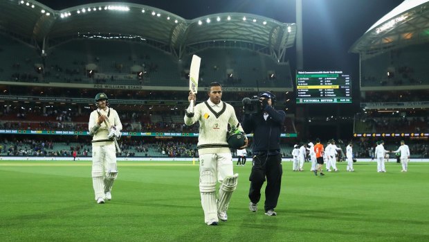 Run machine: Usman Khawaja is applauded off the Adelaide Oval after his century on day two against South Africa.