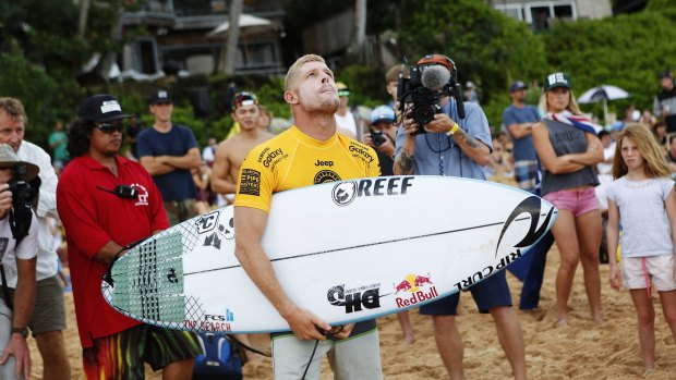 Tribute to brother: Mick Fanning looks to the heavens before his quarter-final heat against Kelly Slater at the Pipe Masters 