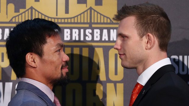 'Stay down': Jeff Horn, right, has received a warning from Manny Pacquiao's corner man before the Sunday fight at Suncorp Stadium.