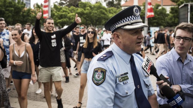 Superintendant David Eardley delivers a press conference as event goers gather in Sydney Olympic Park yesterday.