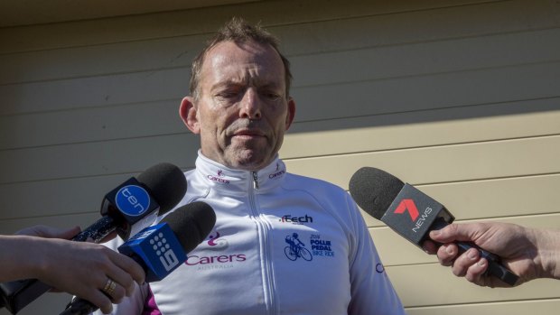 Former prime minister Tony Abbott speaks to the waiting media at his home on Sunday morning. 