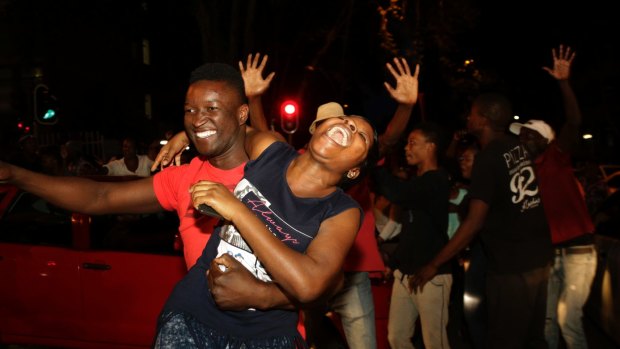 Zimbabweans celebrate in neighbouring Hillbrow, Johannesburg, South Africa.