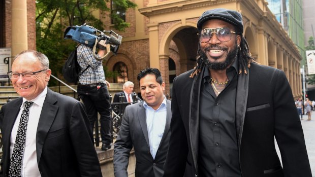 Chris Gayle leaves court after winning his defamation case against Fairfax Media.