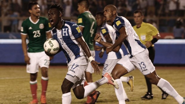 Intimidating arena: Honduras' Alberth Elis after scoring against Mexico in San Pedro Sula.