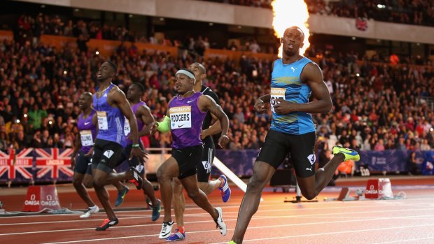 On fire:  Usain Bolt of Jamaica cruises to victory in the 100 metres.