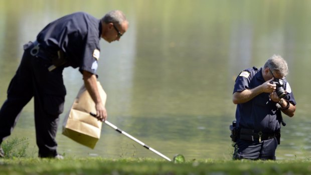 Police in Chicago collecting evidence after the body parts of a toddler were found in a park.