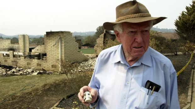 Sir Peter Lawler holds up a small skull, the only thing to be salvaged from his Duffy home destroyed by the 2003 Canberra firestorm. 