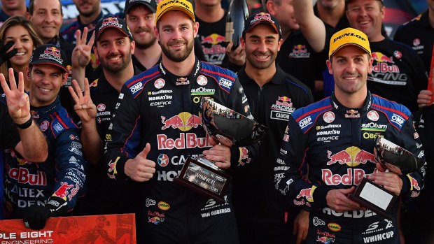 Victorious: Shane Van Gisbergen, Jamie Whincup and the Red Bull team celebrate.