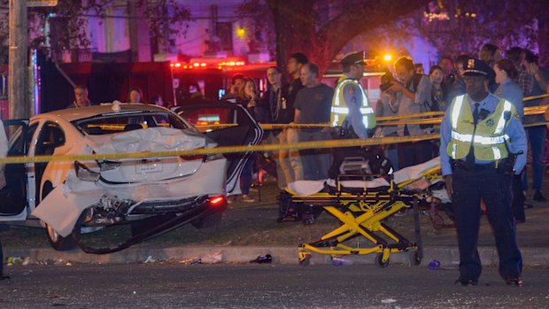 Police respond to the scene in the Mid-City section of New Orleans on Saturday.