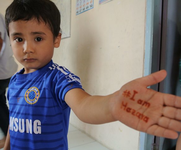 A young asylum seeker child at a "learning centre" set up in Cisarua to educate children while they wait years for a place in Australia. 