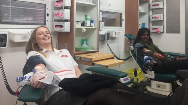 Sophie New, 17 (left) was donating blood for the first time on Friday. Arthy Ananthapavan, 21 (right) has a rare blood type that makes her donations extra valuable.