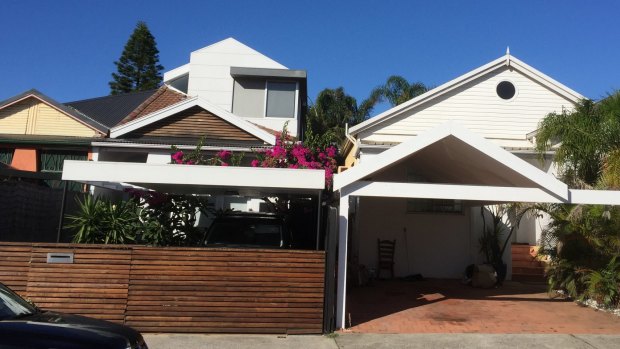 The resident of the house to the right, in Hastings Parade, North Bondi, has been charged with throwing chlorine in the face of his neighbour, who lives in the house on the left.