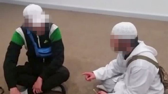 One of the boys, in white, uploaded videos of him converting other young people to Islam.
