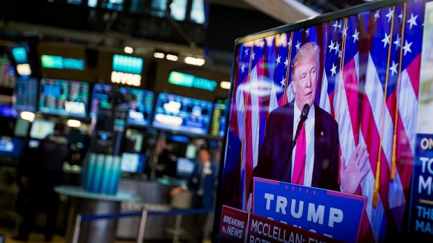 US President-elect Donald Trump is seen speaking on a television on the floor of the New York Stock Exchange (NYSE).