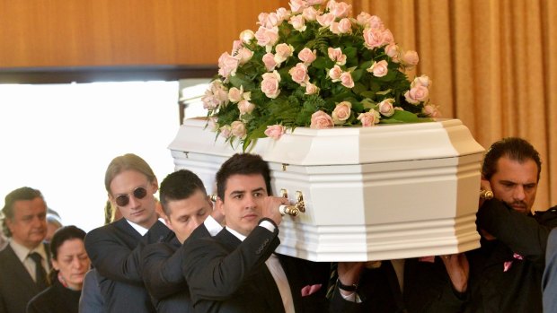 Grieving family and friends farewell Masa Vukotic\.