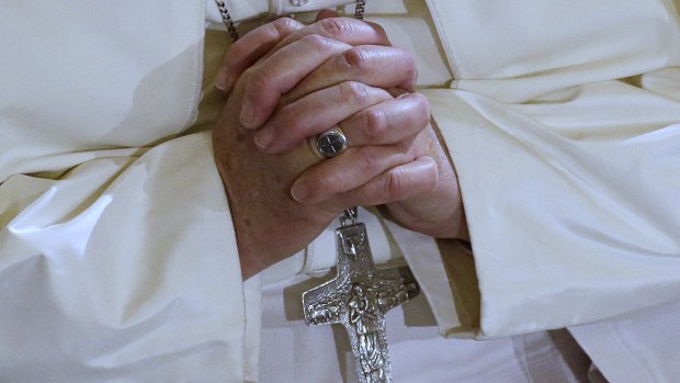 Pope Francis prays during a visit to the Lutheran church, in Rome, on Sunday. 
