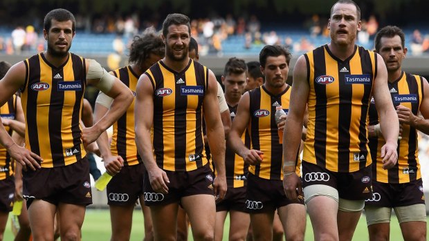 Shock to the system: The Hawks after losing their round two match against Adelaide, after losing to Essendon in round one.