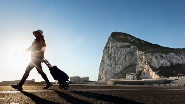 A woman on the Spanish side of the border shared with the British overseas territory of Gibraltar.