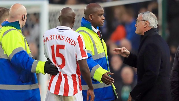 Not impressed: Security staff stand in-between Stoke City's Bruno Martins Indi and Leicester City manager Claudio Ranieri.