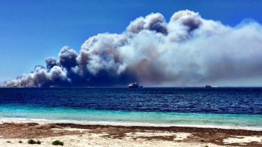 Bushfires have hit Victoria's coastal holiday centres at their busiest time of year. 