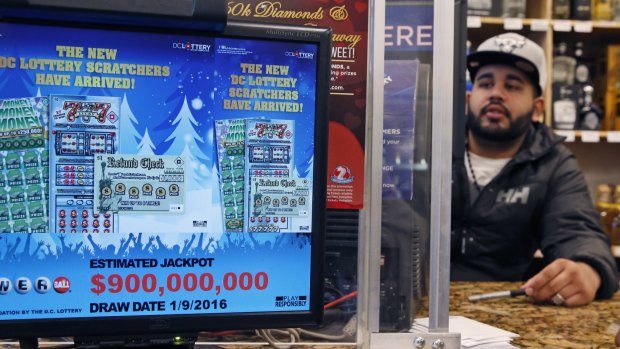 The massive jackpot total flashes on a screen at a lottery outlet in Washington. The total winnings have since increased to $US1.5 billion.