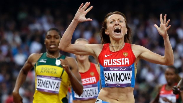 Russia's Mariya Savinova celebrates as she crosses the finish line ahead of South Africa's Caster Semenya during at the London Olympics.