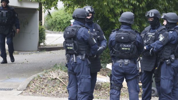 Police search a house in Sydney's west.