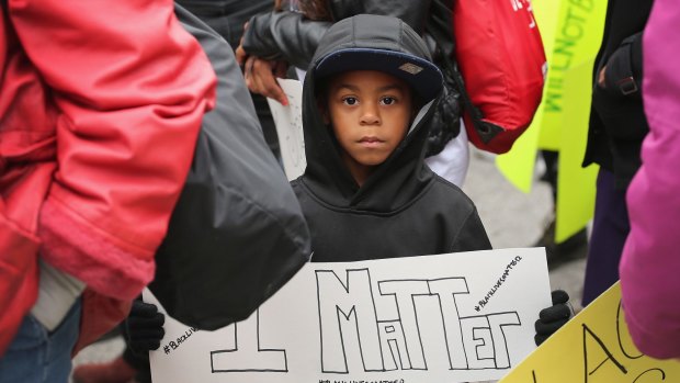 A child holds a sign saying "I Matter" at the St Louis protests.
