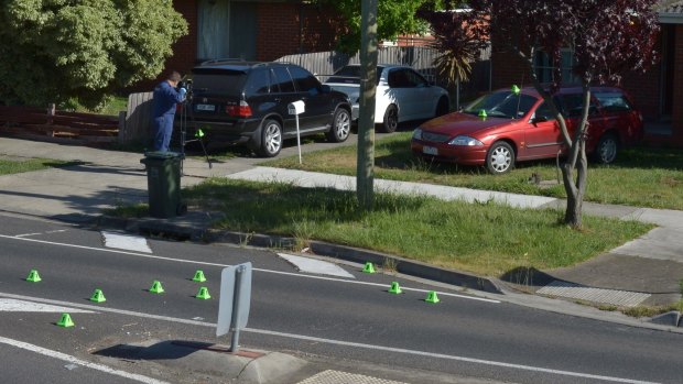 Police at the scene of a drive-by at a home in Thomastown where a 54-year-old-father was killed in a suspected case of mistaken identity.